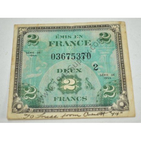 2 Francs currency with written note