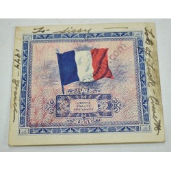 Monnaie de 2 francs avec note écrite