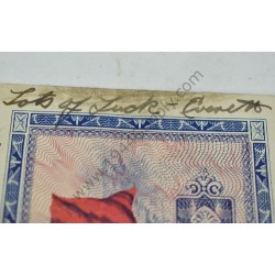 Monnaie de 2 francs avec note écrite