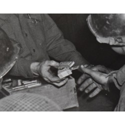 Photo of Captain handing out cigarettes