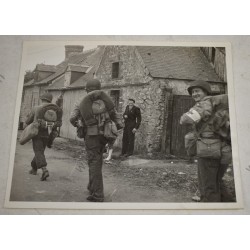 Photo of GI's marching into St Marie du Mont