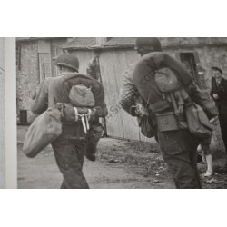 Photo of GI's marching into St Marie du Mont