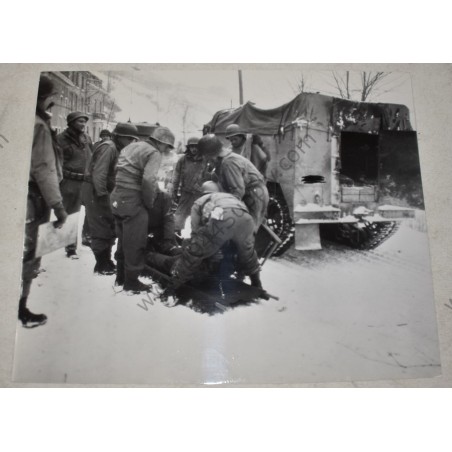 Photo of wounded GI on a stretcher, Belgium