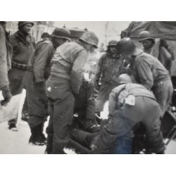 Photo of wounded GI on a stretcher, Belgium