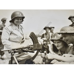 Photo of two nurses at a Bren gun