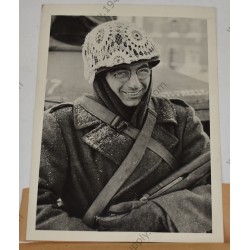 Photo of GI with makeshift winter camouflage on helmet
