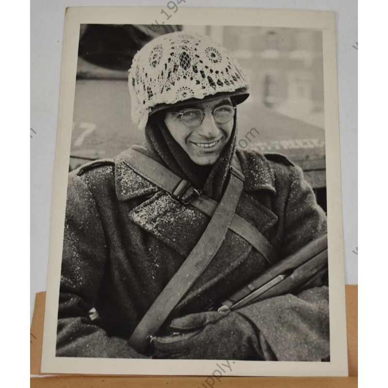 Photo of GI with makeshift winter camouflage on helmet