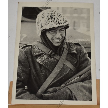 Photo of GI with makeshift winter camouflage on helmet