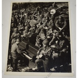Photo of GI's making music