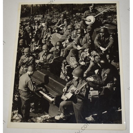 Photo of GI's making music
