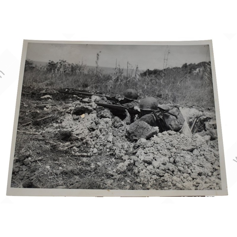 Photo of GI's with camouflaged helmets