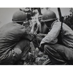 Photo of Medics giving plasma to casualty