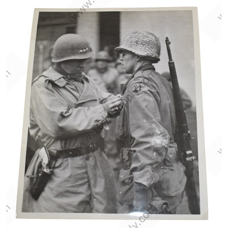 Photo of General Patton decorating a 94th Division GI