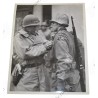 Photo of General Patton decorating a 94th Division GI