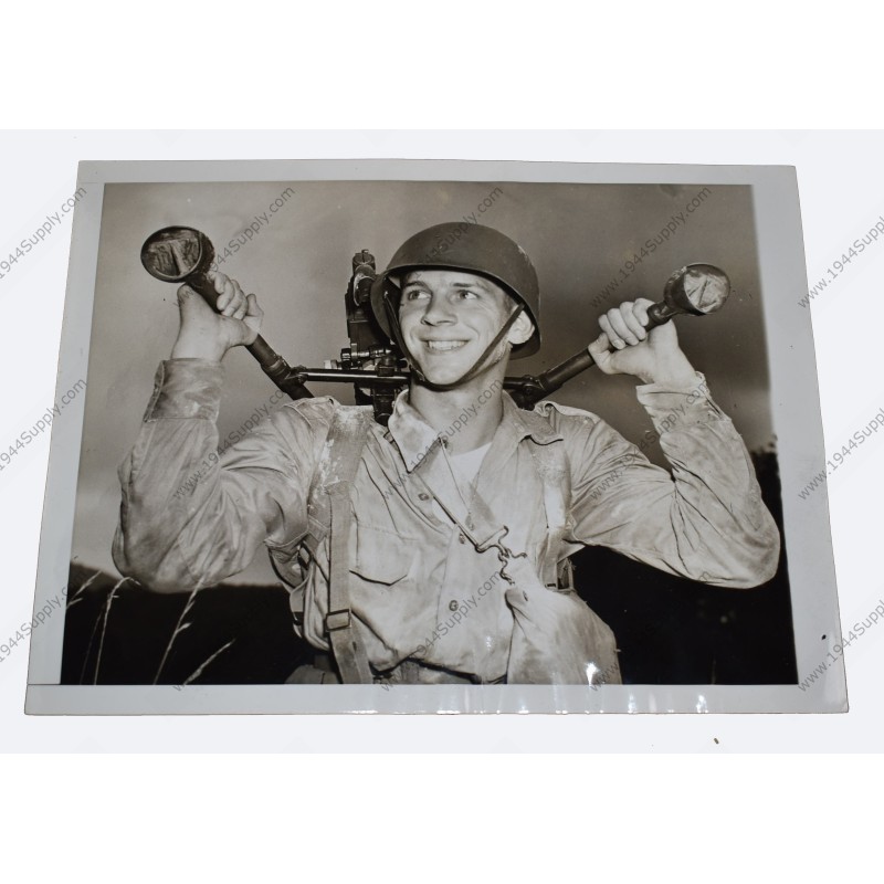 Photo of John Doolittle carrying machinegun