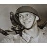 Photo of John Doolittle carrying machinegun